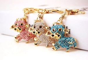 Set di portachiavi a forma di mucca con cristalli rosa, argento e blu e chiusura dorata