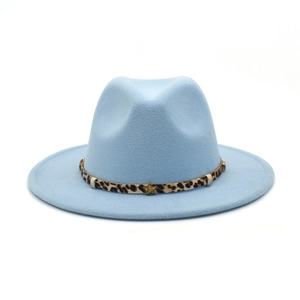 Detail of light blue fedora hat with leopard print band and gold star metal accessory