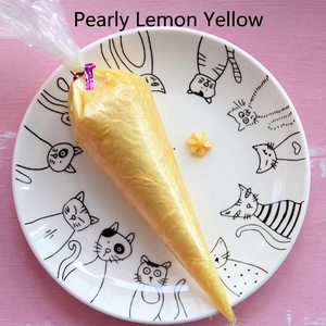 Pearlescent lemon yellow cream glue in a piping bag for DIY phone case crafts