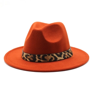 Detail of wool fedora with leopard print band and metallic studs in rusty red