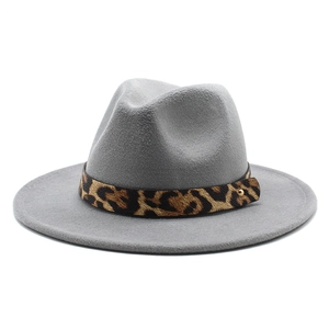Detail of grey wool fedora hat featuring leopard print ribbon and gold metal stud