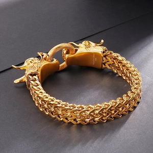 Men's double dragon head bracelet in 316L gold stainless steel shown from 45-degree angle