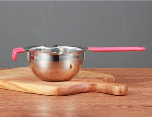 Detail of 304 stainless steel melting pot featuring a pink heat-resistant handle