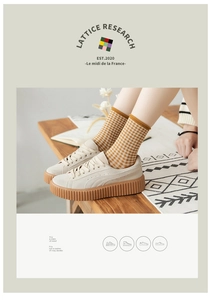 Retro plaid socks paired with cream suede platform sneakers on a wooden table