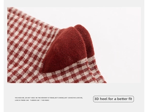 Close-up of a red and white gingham cotton sock showing the reinforced knit heel detail