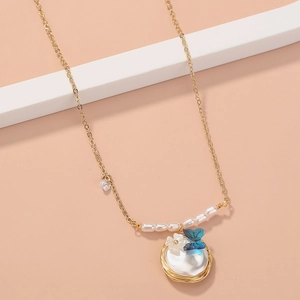 Elegant gold necklace featuring oval pearl pendant with blue butterfly and flower accents