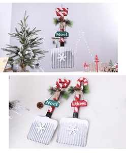 Rustic Christmas spade hanger with Noel and Welcome signs featuring pine needles and cones