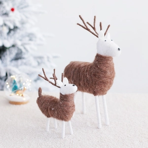 Handmade wool felt Christmas reindeer ornaments in brown and white for holiday home decor