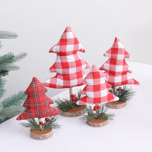 Set of four mini Christmas trees with red and green plaid fabric and wooden bases