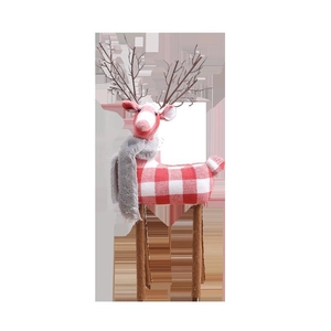 Christmas reindeer decoration in red and white plaid with gray scarf and branch antlers