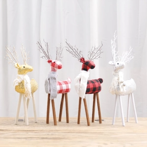 Set of four cotton Christmas reindeer figurines in gold and plaid patterns for table decor
