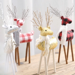 Charming Christmas reindeer ornaments in fabric and sequins for festive window display