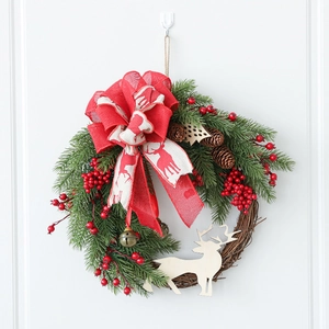 Lush Christmas wreath with pine cones berries and wooden elk on white background