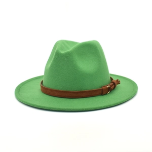 Detail of green wool fedora hat featuring a brown suede band and metal buckle