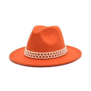 Detail of orange wool fedora featuring an elegant triple-row white pearl decorative band