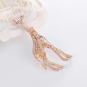 Golden enamel giraffe brooch with cute geometric design and secure back pin closure