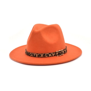 Detail of orange wool fedora hat featuring a leopard print belt and gold metal buckle