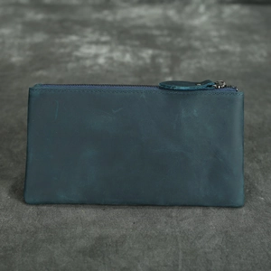 Deep blue crazy horse leather wallet with vintage texture and matching zipper puller
