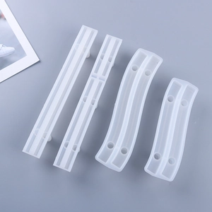 Detailed view of four semi-transparent silicone tray handle molds for DIY resin casting