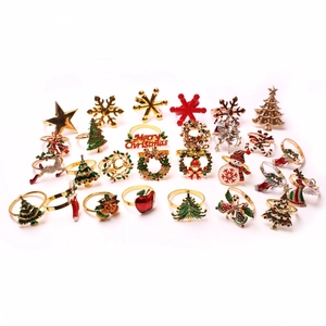 Assorted Christmas metal napkin rings featuring reindeer snowflakes and holiday trees