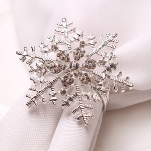 Elegant silver snowflake napkin ring with sparkling rhinestones for festive table decor
