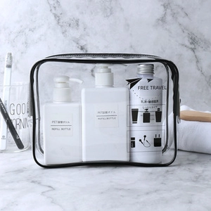 Detailed view of clear PVC waterproof travel bag with black trim and smooth metal zipper