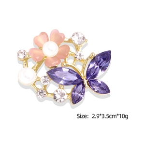 Exquisite gold butterfly brooch with purple rhinestones and pink floral pearl accents
