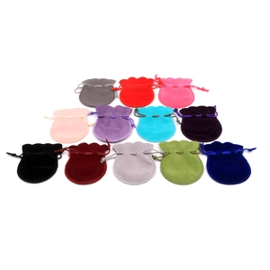 Variety of colorful velvet drawstring jewelry pouches in twelve different shades