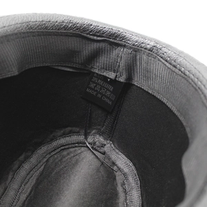 Close-up of the wash label inside the PU leather jazz hat showing material composition