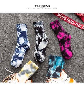 Close-up of five pairs of cotton tie-dye mid-calf socks with ribbed texture in a street style