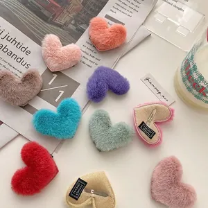 Colorful plush heart-shaped hair clips in candy tones with soft fur and metal bb clip