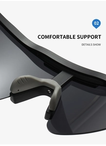 Macro detail of ergonomic gray rubber nose pads on matte black sports sunglasses