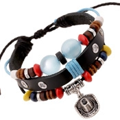 Detail of multilayer woven leather bracelet with wooden beads and cowboy hat charm