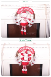 Detail of Christmas wreaths with plush snowman and reindeer on natural vine base