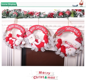 Three-piece Christmas wreath set featuring Santa, Elk, and Snowman dolls on white fireplace