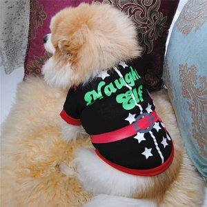 Pomeranian wearing a black Christmas dog t-shirt with Naughty Elf print on a cozy rug