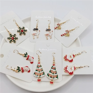 Christmas drop earring set with festive Santa, deer, tree, and snowflake patterns