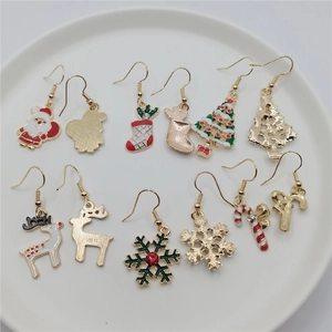 Handcrafted Christmas themed earrings set with Santa, reindeer, and snowflakes motifs