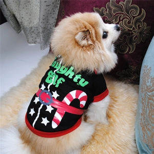 Detail shot of a black Christmas dog T-shirt featuring Naughty Elf print on a Pomeranian