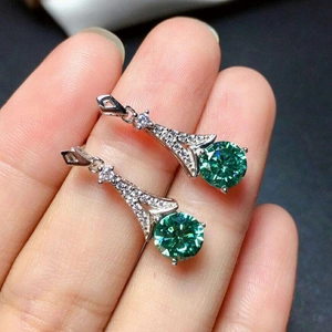 Silver drop earrings with round green moissanite stones and pavé set white accents