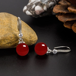 Ethnic style silver earrings with round red chalcedony beads and sparkling zircon accents