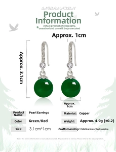 Detail view of ethnic green agate earrings with diamond accents and silver plating