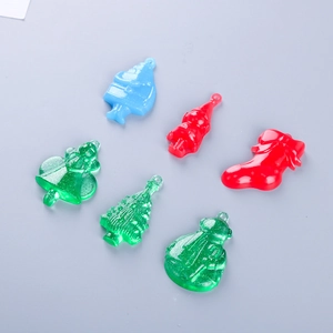 Detail showing 6-piece resin Christmas charms with glitter finish and hanging holes