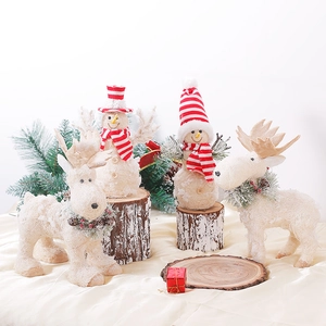 Nordic Christmas snowman and reindeer figurine set with knitted hats and snow texture