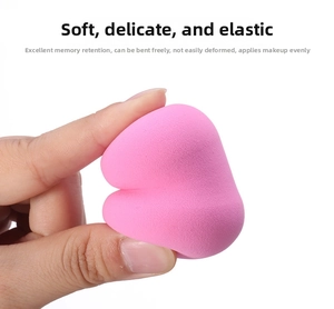 Close-up of flexible pink makeup sponge showing soft texture and elastic memory material