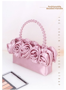 Elegante borsa in raso rosa con rose 3D e manico decorato con perle rosa