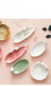 Close-up of bird ceramic jewelry tray with leaf shape and premium matte finish details