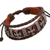 Close-up of brown double-layer leather bracelet with silver cross metal charms
