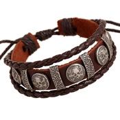 Detail of brown woven leather bracelet with metal skull charms and adjustable knot