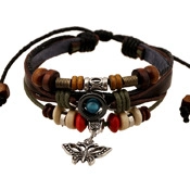 Detailed view of layered brown leather bracelet with wooden beads and metal butterfly charm